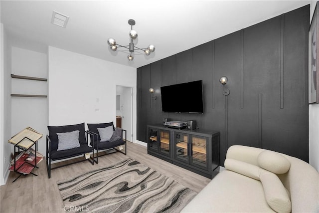 9958 Artesia Blvd Unit 1003, Bellflower, CA 90706 - living area featuring light wood-style flooring and a chandelier