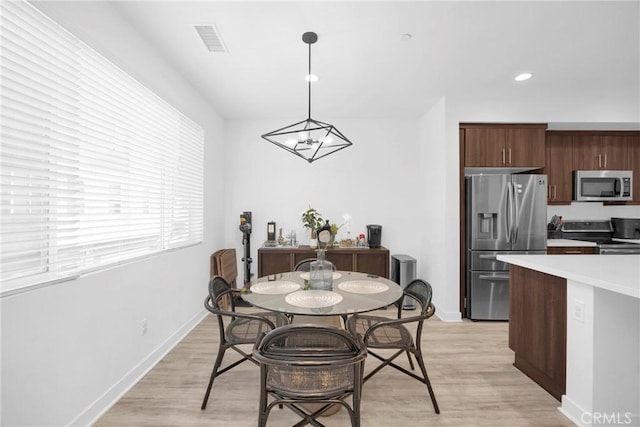 9958 Artesia Blvd Unit 1003, Bellflower, CA 90706 - dining area with light wood finished floors and recessed lighting