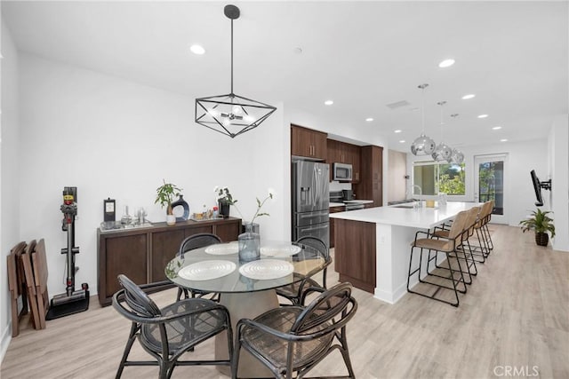 9958 Artesia Blvd Unit 1003, Bellflower, CA 90706 - dining room with light wood-style floors and recessed lighting