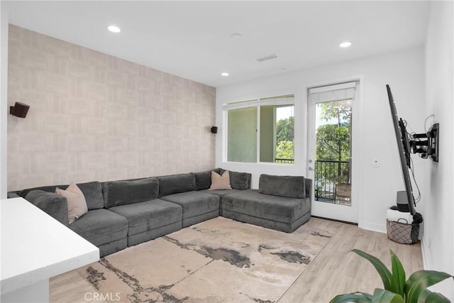 9958 Artesia Blvd Unit 1003, Bellflower, CA 90706 - living room featuring wood finished floors, recessed lighting, and an accent wall