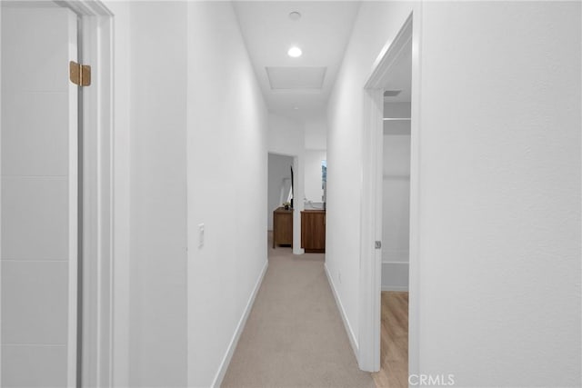 9958 Artesia Blvd Unit 1003, Bellflower, CA 90706 - hallway featuring light colored carpet, attic access, and recessed lighting