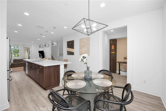 9958 Artesia Blvd Unit 1003, Bellflower, CA 90706 - dining space featuring light wood finished floors, recessed lighting, a chandelier, and stairs