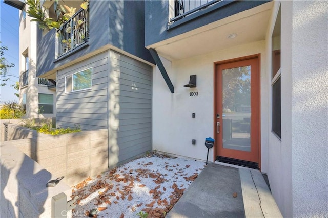 9958 Artesia Blvd Unit 1003, Bellflower, CA 90706 - view of exterior entry with a balcony
