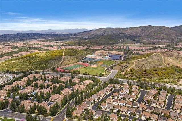 103 Winnett, Irvine, CA 92602 - aerial overview of property's location with a mountain backdrop and nearby suburban area
