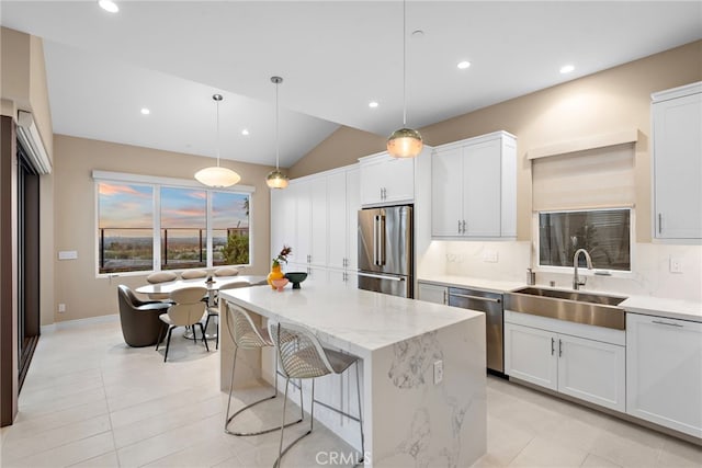 103 Winnett, Irvine, CA 92602 - kitchen featuring stainless steel appliances, tasteful backsplash, a kitchen island, recessed lighting, and light tile patterned floors