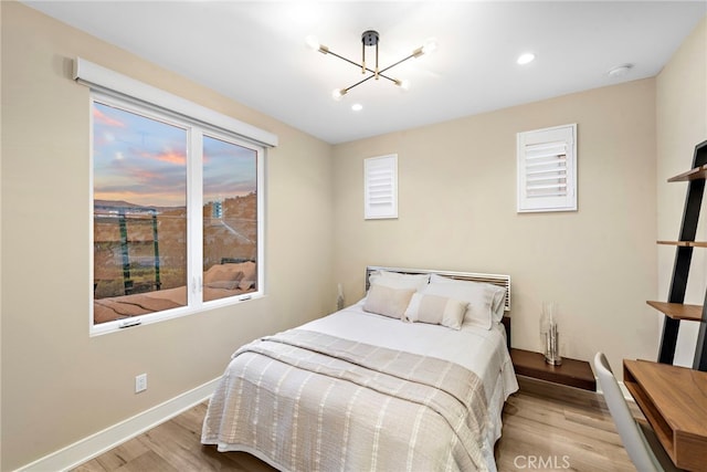 103 Winnett, Irvine, CA 92602 - bedroom with wood finished floors, a chandelier, multiple windows, and recessed lighting