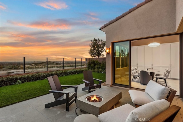 103 Winnett, Irvine, CA 92602 - patio terrace at dusk featuring a fire pit and a patio area