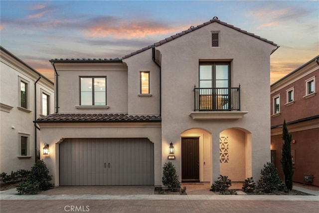 103 Winnett, Irvine, CA 92602 - mediterranean / spanish home with a balcony, a tile roof, stucco siding, and a garage