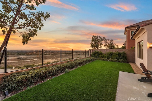 103 Winnett, Irvine, CA 92602 - yard at dusk featuring a fenced backyard and a patio