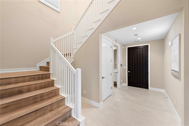 103 Winnett, Irvine, CA 92602 - foyer entrance featuring stairs, light tile patterned flooring, and recessed lighting