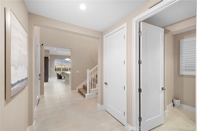 103 Winnett, Irvine, CA 92602 - hallway with stairs and light tile patterned flooring