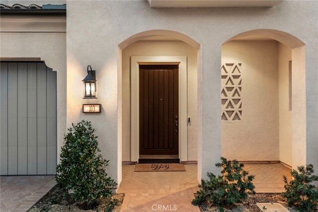 103 Winnett, Irvine, CA 92602 - doorway to property with stucco siding