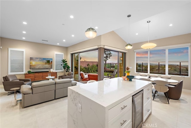 103 Winnett, Irvine, CA 92602 - kitchen featuring light tile patterned floors, white cabinetry, recessed lighting, wine cooler, and light stone counters