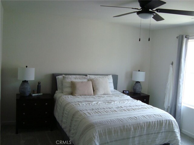 435 N Beechwood Ave, Rialto, CA 92376 - bedroom with multiple windows, ceiling fan, and carpet