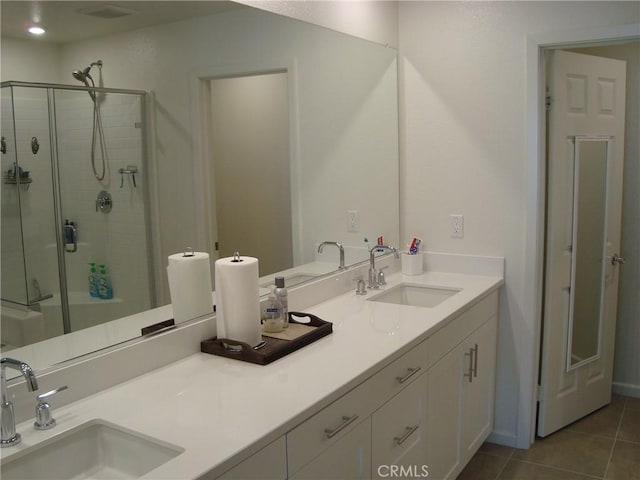 435 N Beechwood Ave, Rialto, CA 92376 - full bathroom with double vanity, a stall shower, and tile patterned floors