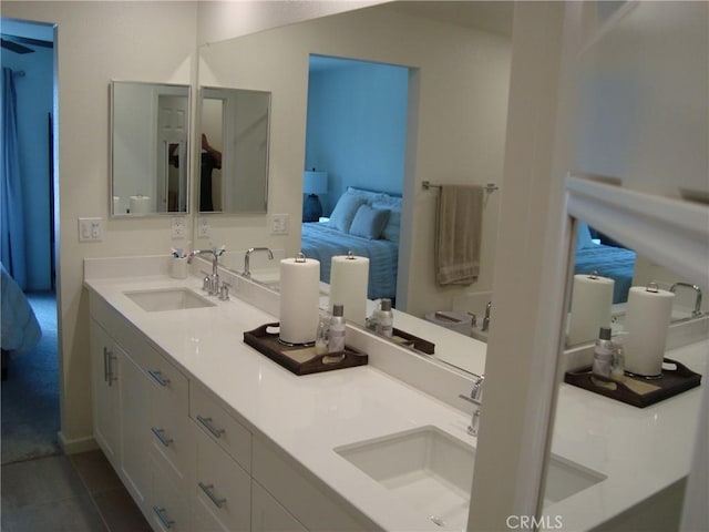 435 N Beechwood Ave, Rialto, CA 92376 - ensuite bathroom with double vanity and tile patterned flooring
