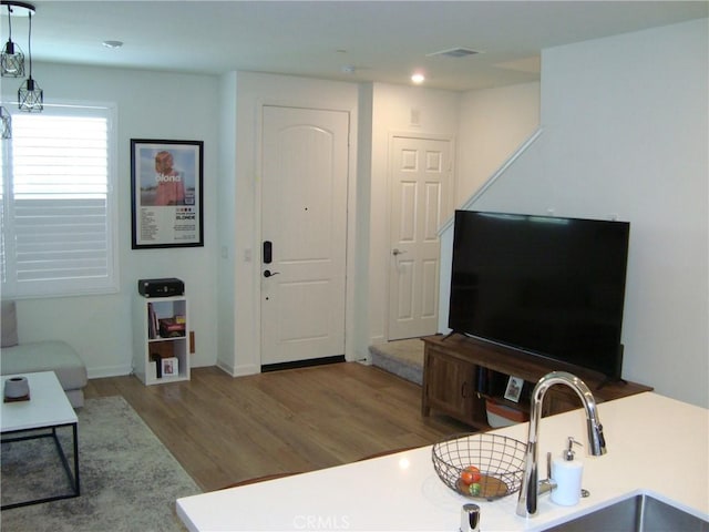 435 N Beechwood Ave, Rialto, CA 92376 - living room featuring wood finished floors and recessed lighting
