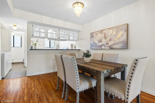 13725 Los Angeles St Unit H, Baldwin Park, CA 91706 - dining room featuring washer / dryer and wood finished floors