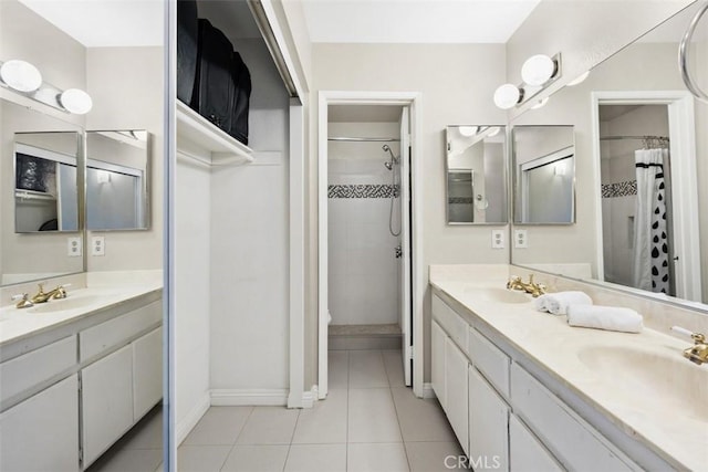 13725 Los Angeles St Unit H, Baldwin Park, CA 91706 - full bathroom featuring double vanity, a tile shower, and tile patterned floors