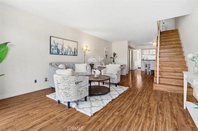 13725 Los Angeles St Unit H, Baldwin Park, CA 91706 - living area featuring stairway and wood finished floors