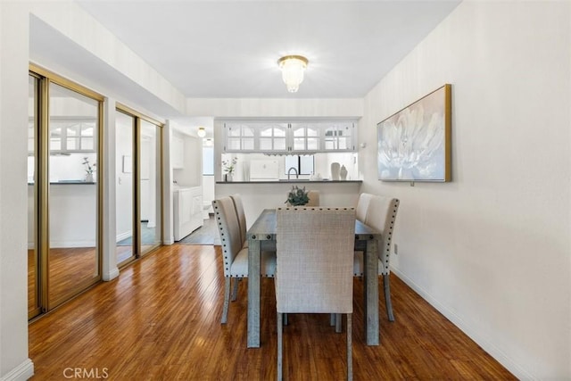 13725 Los Angeles St Unit H, Baldwin Park, CA 91706 - dining space featuring wood finished floors and washer / clothes dryer