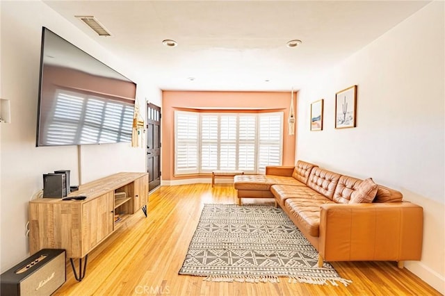 5855 Daneland St, Lakewood, CA 90713 - living area featuring light wood-type flooring and baseboards