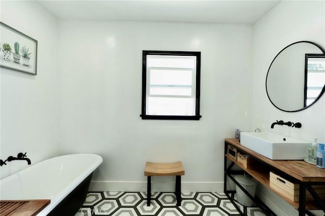 5855 Daneland St, Lakewood, CA 90713 - full bath featuring healthy amount of natural light, a freestanding bath, and vanity