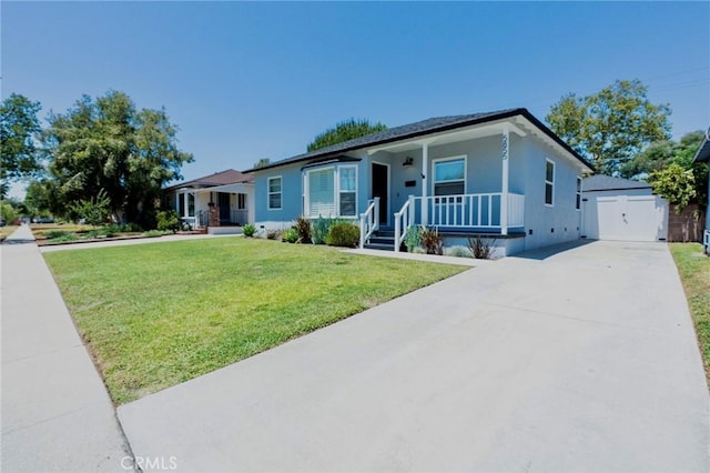 5855 Daneland St, Lakewood, CA 90713 - ranch-style house featuring a porch, an outbuilding, a front lawn, driveway, and stucco siding