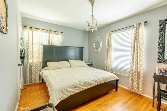 5855 Daneland St, Lakewood, CA 90713 - bedroom featuring wood finished floors and a chandelier