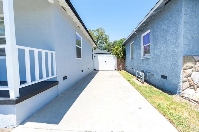 5855 Daneland St, Lakewood, CA 90713 - view of side of property featuring crawl space, stucco siding, and a patio area