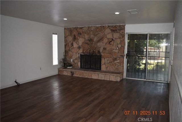1331 Bothwell Ave, Colton, CA 92324 - unfurnished living room with wood finished floors, healthy amount of natural light, and a stone fireplace
