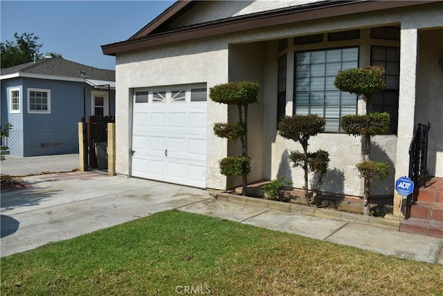 1331 Bothwell Ave, Colton, CA 92324 - view of home's exterior with a garage, driveway, and stucco siding