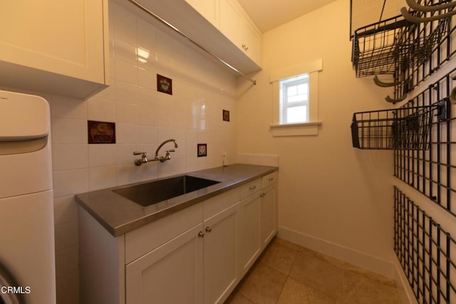 5512 Ranchito Ave, Sherman Oaks, CA 91401 - kitchen featuring white cabinets, light tile patterned floors, backsplash, and dark countertops
