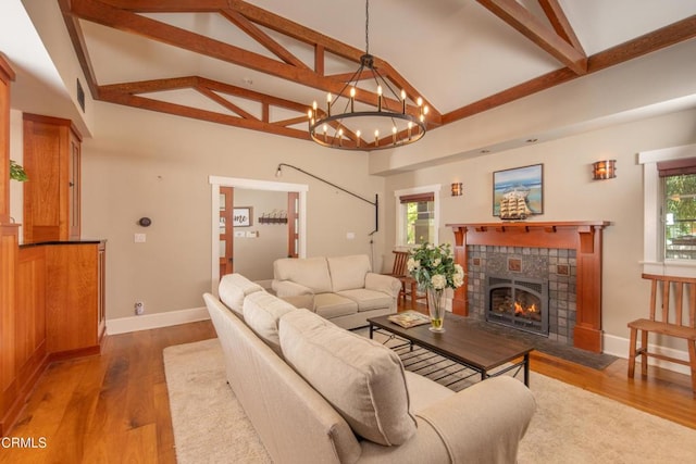 5512 Ranchito Ave, Sherman Oaks, CA 91401 - living room featuring plenty of natural light, beam ceiling, wood finished floors, a chandelier, and high vaulted ceiling