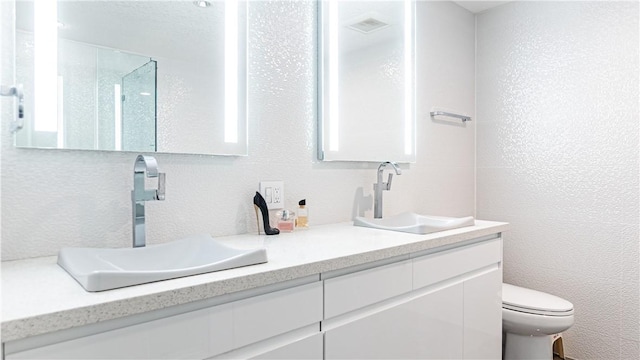 3131 Michelson Dr Unit 901, Irvine, CA 92612 - bathroom featuring double vanity and a shower