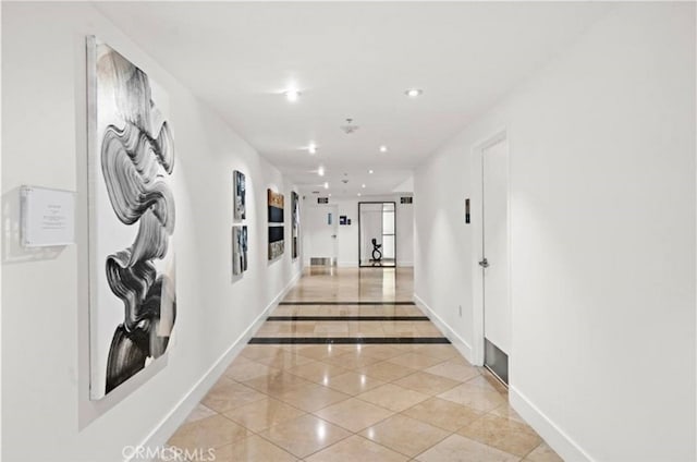 3131 Michelson Dr Unit 901, Irvine, CA 92612 - hallway featuring light tile patterned floors, recessed lighting, and inlaid floor details