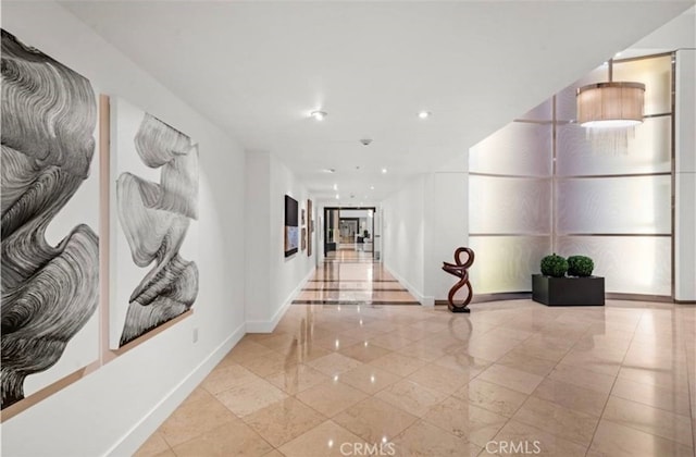 3131 Michelson Dr Unit 901, Irvine, CA 92612 - corridor with marble tiled floors and recessed lighting