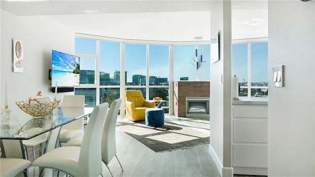 3131 Michelson Dr Unit 901, Irvine, CA 92612 - living room with wood finished floors, a fireplace, and expansive windows