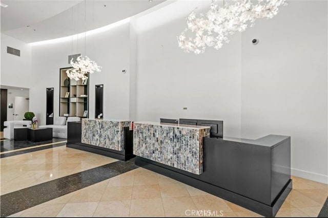 3131 Michelson Dr Unit 901, Irvine, CA 92612 - reception area featuring a chandelier and a towering ceiling