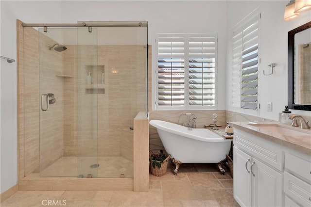 10844 Aster Ln, Apple Valley, CA 92308 - bathroom featuring a freestanding bath, a shower stall, and vanity