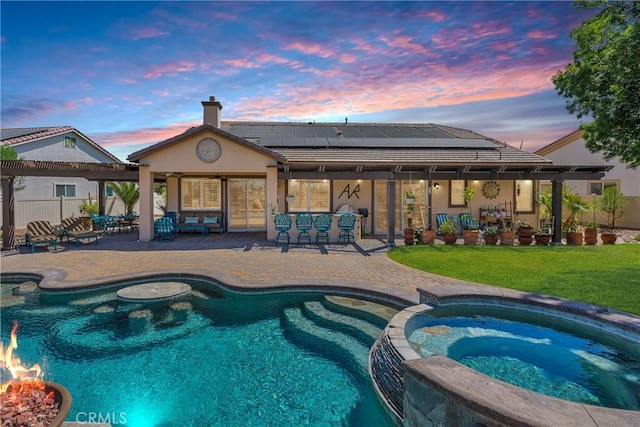 10844 Aster Ln, Apple Valley, CA 92308 - pool at dusk featuring a pool with connected hot tub and a patio