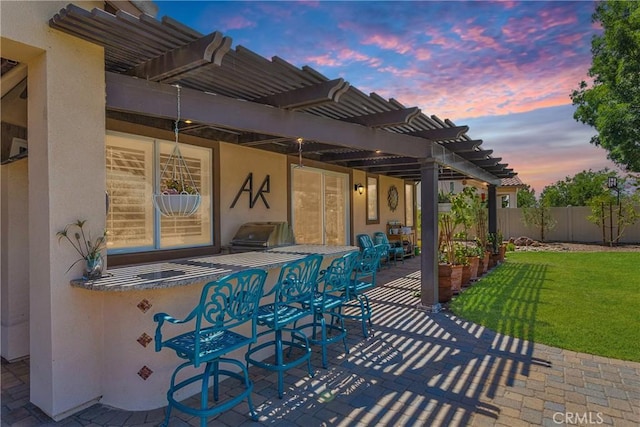 10844 Aster Ln, Apple Valley, CA 92308 - patio terrace at dusk with a pergola, a patio, and area for grilling