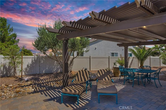 10844 Aster Ln, Apple Valley, CA 92308 - patio terrace at dusk featuring a fenced backyard, a pergola, and a patio