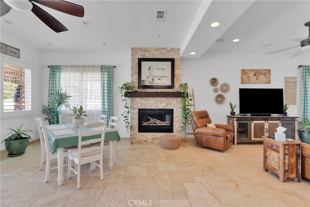 10844 Aster Ln, Apple Valley, CA 92308 - living room with ceiling fan, stone tile floors, a stone fireplace, and recessed lighting