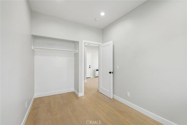 1221 E 1st St, Long Beach, CA 90802 - unfurnished bedroom featuring light wood-style flooring and a closet