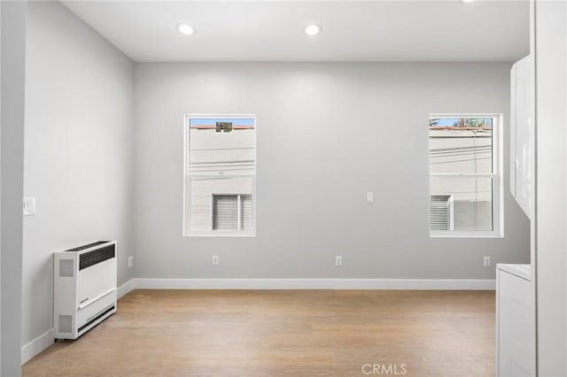1221 E 1st St, Long Beach, CA 90802 - unfurnished room with heating unit, light wood-style floors, and recessed lighting