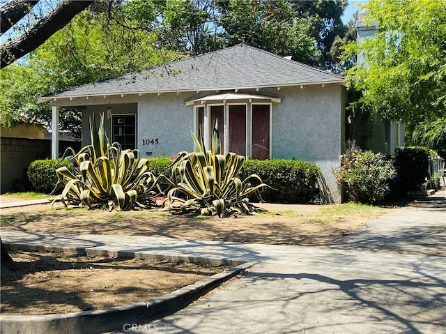1045 Locust St, Pasadena, CA 91106 - view of front of property with stucco siding and roof with shingles