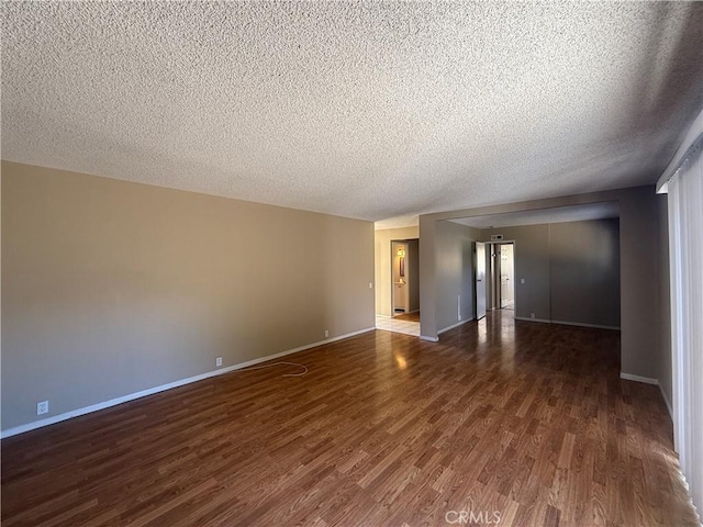 2854 Coronado Ave, San Diego, CA 92154 - unfurnished room with a textured ceiling and wood finished floors