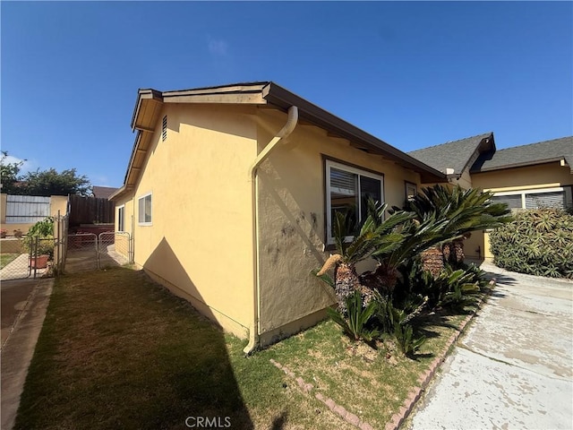 2854 Coronado Ave, San Diego, CA 92154 - view of side of property featuring stucco siding and a gate