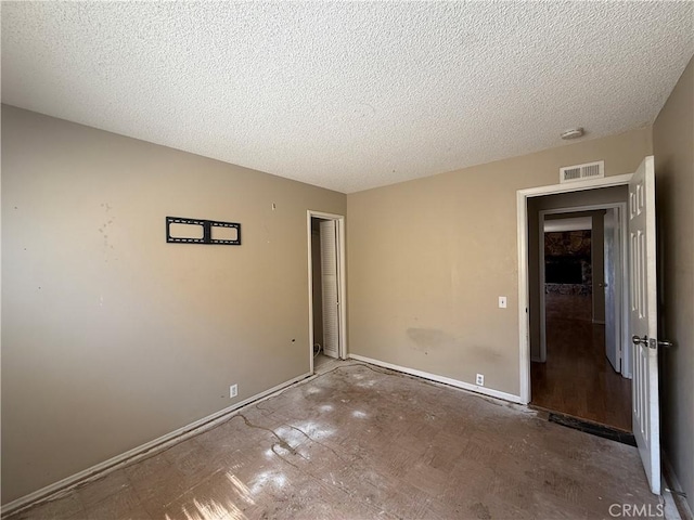 2854 Coronado Ave, San Diego, CA 92154 - unfurnished bedroom featuring baseboards and a textured ceiling
